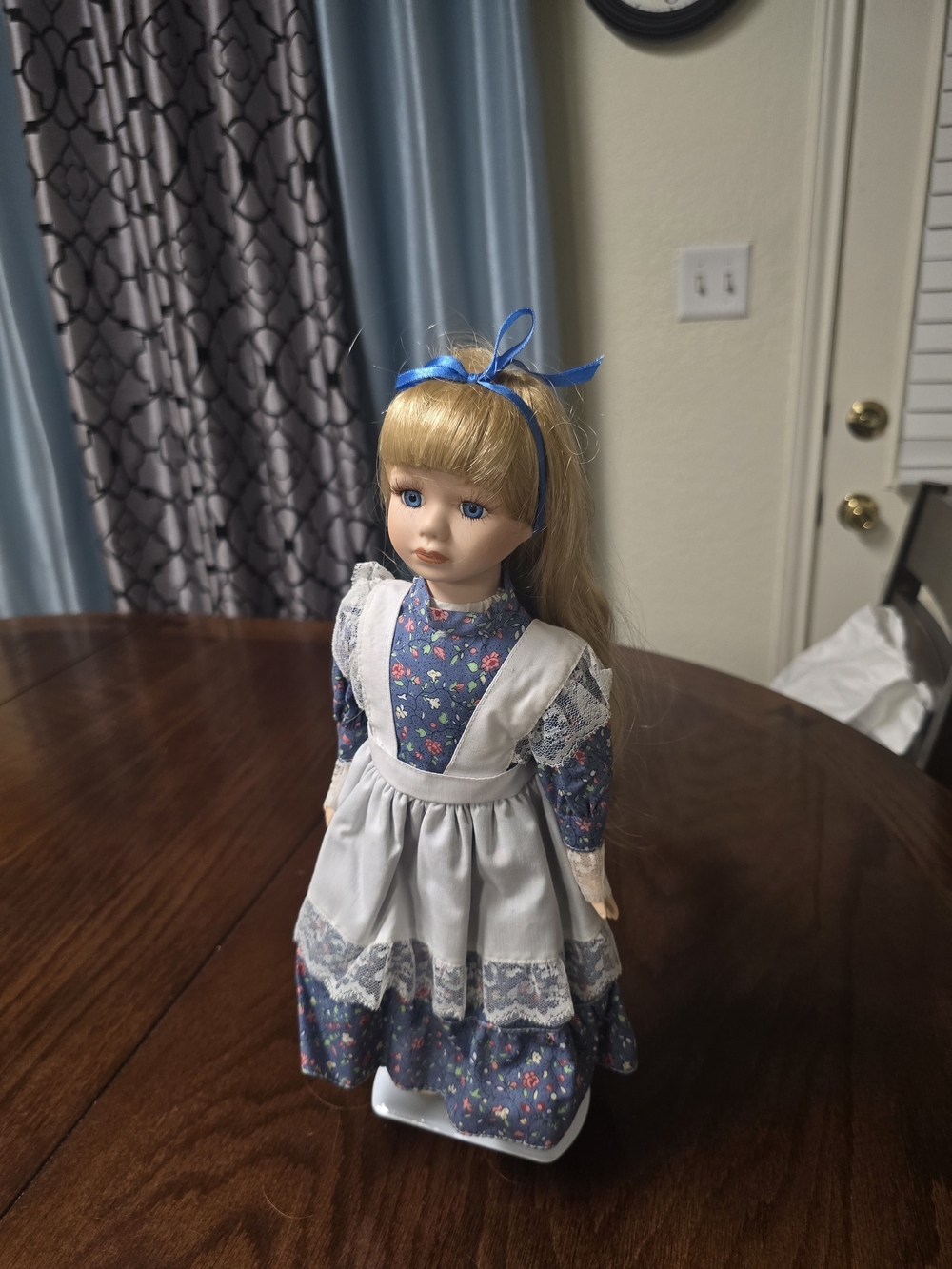 Porcelain Girl Doll in Blue Floral Dress with White Apron